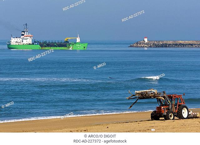 Tractor cleaning beach, dredger, Anglet, Aquitaine, Basque Country, France, Pays Basque