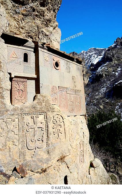 Cells of Geghard rock monastery with ancient khachkars - memorable crosses, , Armenia, Caucasus, unesco world heritage site