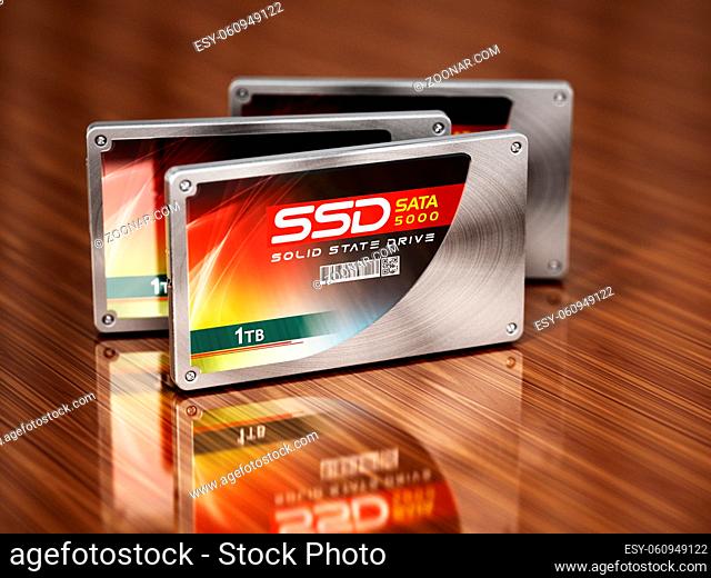 Generic SSDs standing on wooden table. 3D illustration
