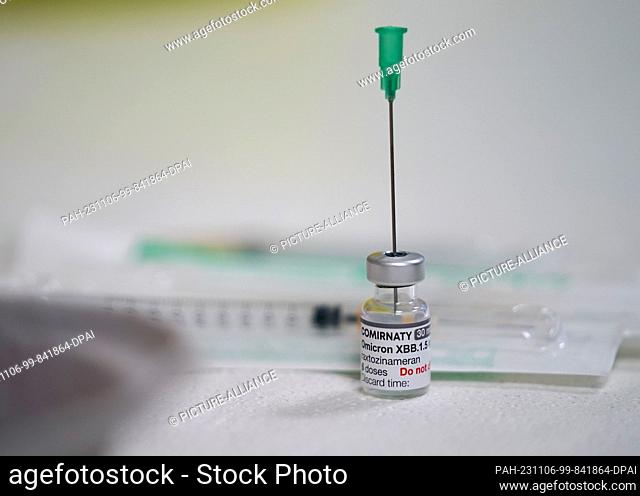 06 November 2023, Hamburg: An employee prepares a corona vaccination with the Biontech vaccine Comirnaty adapted to the Omicron variant XBB 1