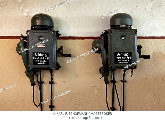 Two telephones in a bunker from the 2nd World War with inscription, the enemy is listening, in German, open-air museum Atlantic Wall, Raversijde or Raversyde