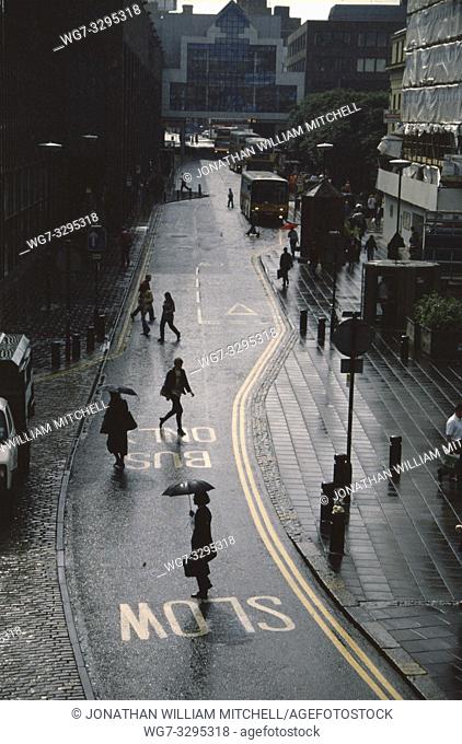 UK Newcastle-upon-Tyne -- circa 1992 -- Pedestrians brave the rain in Newcastle upon Tyne England UK -- Picture by Jonathan Mitchell/Atlas Photo Archive