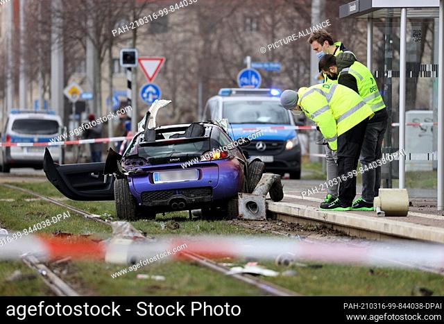 16 March 2021, Saxony, Leipzig: Dekra experts stand at the scene of the accident. A car driver drove into a group of people in Leipzig on Tuesday