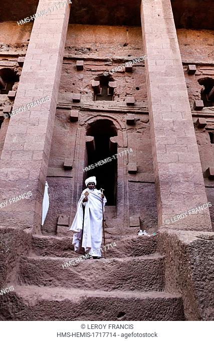 Ethiopia, Amhara region, Lalibela, priest before the rock-hewn church Bet Medhane Alem (the northwest cluster) listed as World Heritage by UNESCO