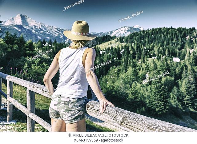 Mountains landscape in summer with woman. Velika Planina area. Upper Carniola region. Slovenia, Europe