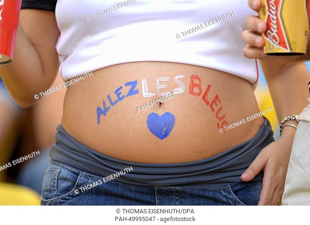 A pregnant woman and supporter of France seen before the FIFA World Cup 2014 quarter final soccer match between France and Germany at Estadio do Maracana in Rio...
