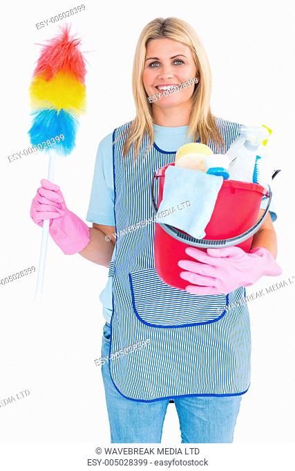 Cleaning woman holding feather duster with a bucket in the white background