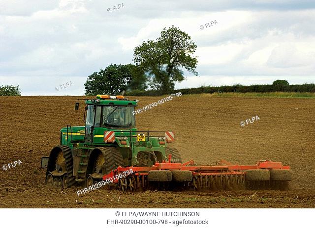 Tractor with crawler tracks, ploughing and cultivating seedbed, England