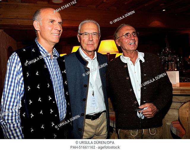 Soccer legend Franz Beckenbauer (C), his son Thomas (L) and his brother Walter are pictured during the gala on occasion of 'Camp Beckenbauer' in Going, Austria