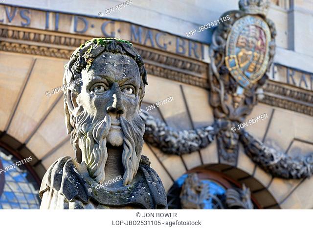 England, Oxfordshire, Oxford. The head of an 'Emperor', one of thirteen busts on top of pillars marking the front boundary of the Sheldonian Theatre