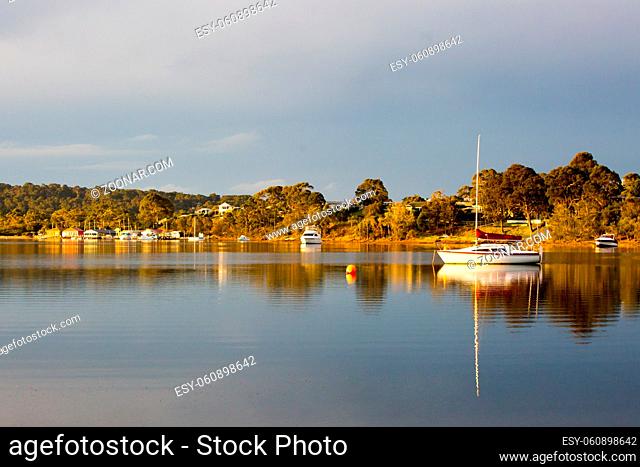 The idyllic setting across Wagonga Inlet at sunset in Narooma, NSW, Australia