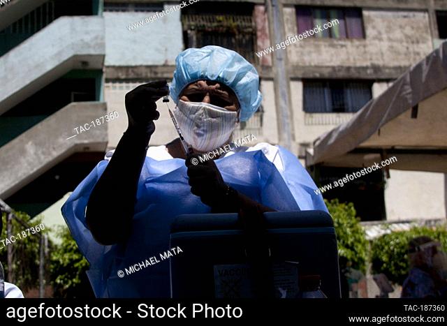 CARACAS, VENEZUELA - JUNE 7: A nurse prepares a  Covid-19 dose, inside sporty of the colony January 23, during Massive day of vaccination program against...