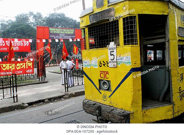 Front View of Tram With Communist part of India flag on the Street of  Kolkata ; West Bengal ; India