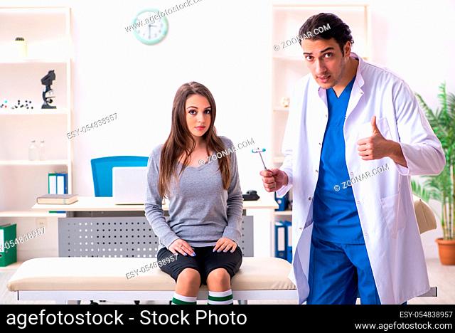 Young male doctor and female beautiful patient