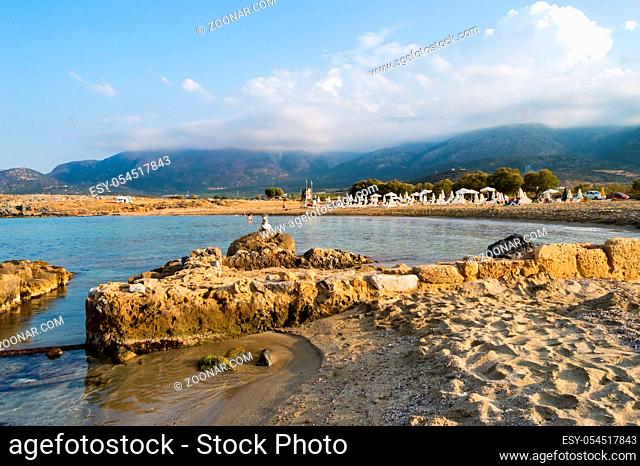 Beautiful wild beach with clear turquoise water and rocks. Malia, Crete island, Greece