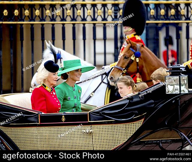 Queen Camilla, Catherine, Princess of Wales Prince George of Wales and Princess Charlotte of Wales and Prince Louis of Wales leaves at Buckingham Palace in...