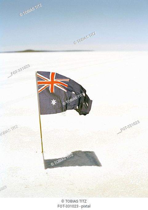 Australian flag planted into salt flat