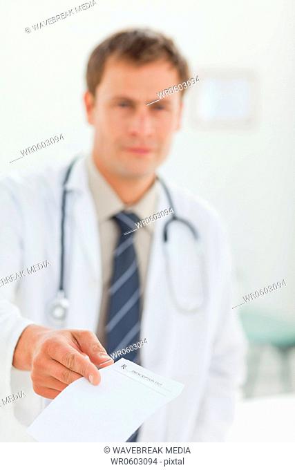 Doctor handing over prescription