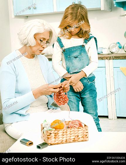 Grandmother And Grandchild Knitting Socks Little Blond Lady Looking How Her Granny Knitting With Threads Grandmother Teaching Her Granddaughter