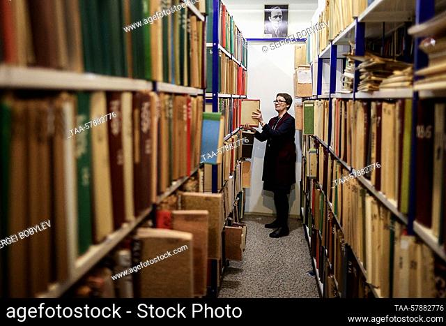 RUSSIA, MOSCOW REGION - MARCH 15, 2023: A woman works in a paper archive of Gosfilmofond, the state-run film archive, in the town of Domodedovo
