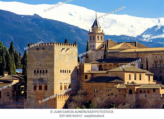 The Alhambra of Granada in Spain with Sierra Nevada snowy mountains as backgorund . Photo taken from the Albaicin, the moorish district of Granada