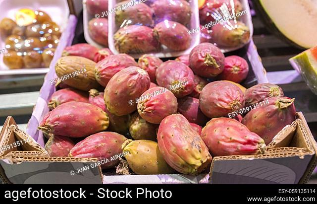 Clean prickly pear or barbary figs. Exhibited on cardboard box and packed tray