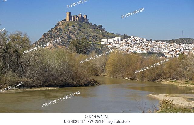 Almodovar del Rio, Cordoba Province, Spain. Almodovar castle and town seen behind the Guadalquivir river.  Founded as a Roman fort the castle developed into its...
