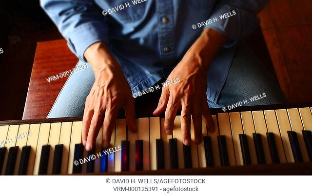 Hands of a musician playing piano in Providence, Rhode Island
