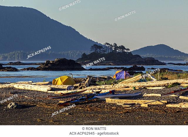 Kayakers set up camp on an island in Nuchatlitz Provincal Park, off the west coast of Vancouver Island British Columbia, Canada