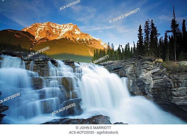 Athabasca Falls with Mount Kerkeslin in the background in early spring, Jasper National Park, Alberta, Canada