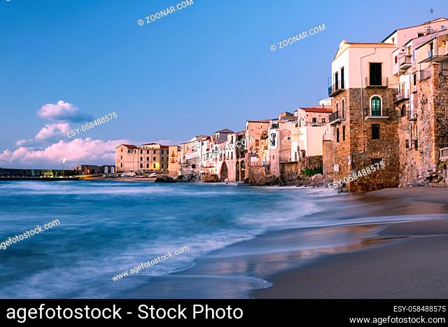 sunset at the beach of Cefalu Sicily, old town of Cefalu Sicilia panoramic view at the colorful village.Italy