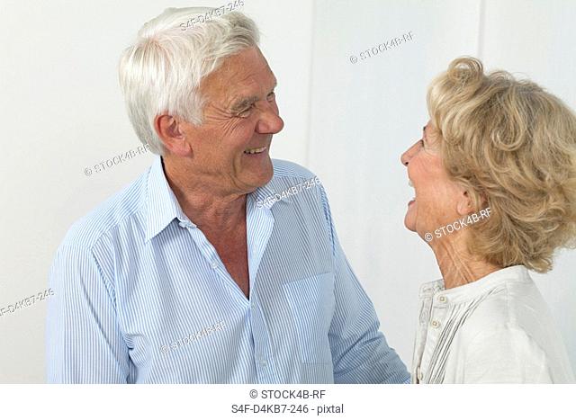Happy senior couple looking at each other