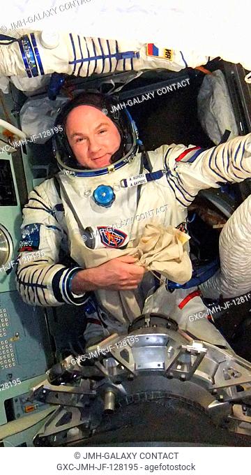 European Space Agency astronaut Andre Kuipers, Expedition 31 flight engineer, prepares for a Sokol suit standard leak check in the Soyuz TMA-03M spacecraft in...