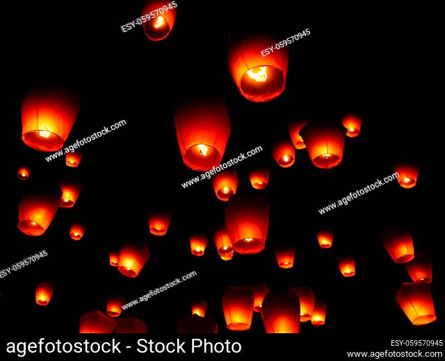 Glowing paper lanterns illuminate the night sky during the Pingxi sky lantern festival in Taiwan