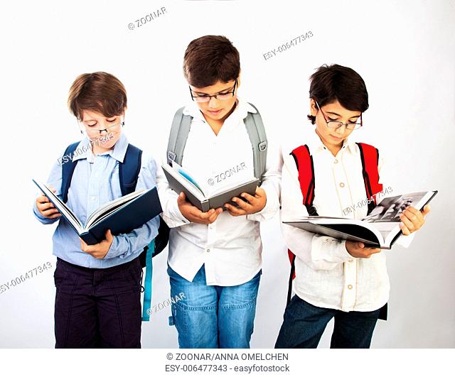 Three smart boys read books