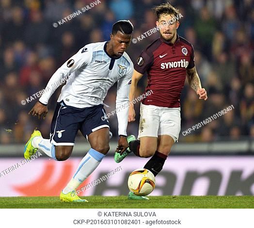 Keita Balde Diao of Lazio, left, and Lukas Vacha of Sparta fight for the ball during the European Football League group of sixteen opening match AC Sparta Praha...