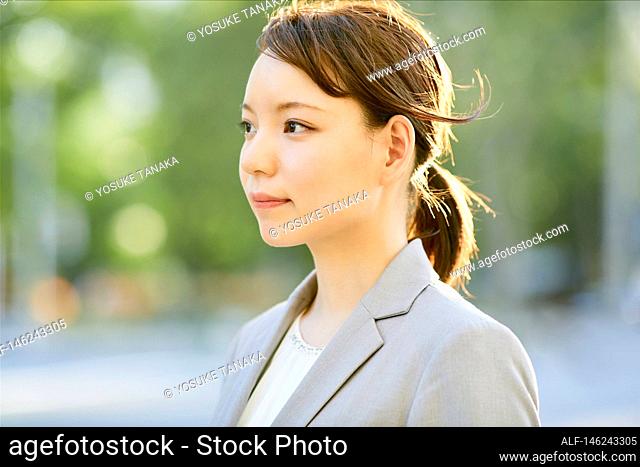 Young Japanese businesswoman outside