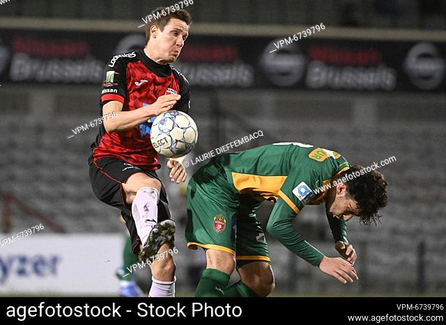 Rwdm's Glenn Claes and Mouscron's Marko Babic fight for the ball during a postponed soccer match from day 18 between RWD Molenbeek and RE Mouscron