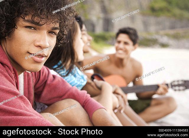 Friends relaxing together on beach