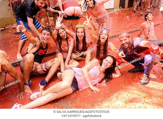 Young people enjoying the Tomatina, the world's largest tomato fight, Tomatina, Buñol, Valencia, Spain