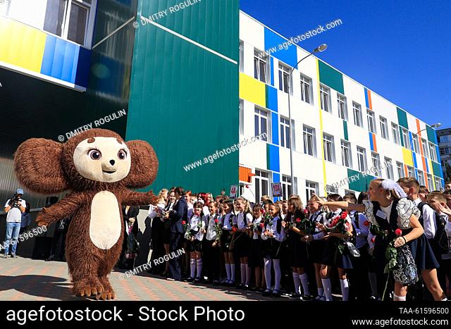 RUSSIA, VOLGOGRAD - SEPTEMBER 1, 2023: An entertainer dressed as Cheburashka, a popular Russian cartoon character, performs during a ceremony on Knowledge Day...