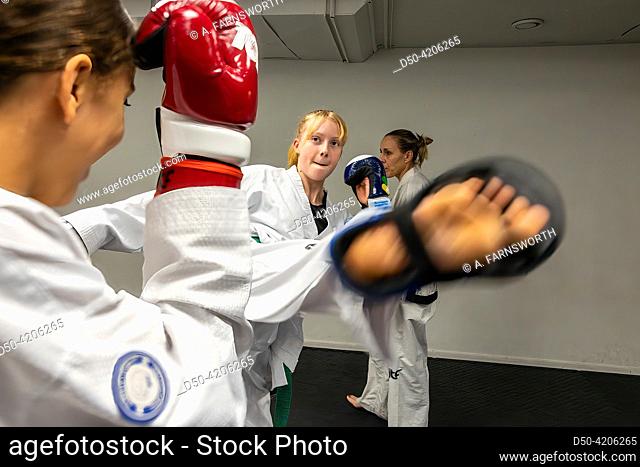 Stockholm, Sweden A group of young Taekwondo students at practice in a gym