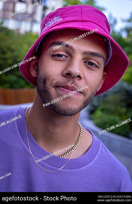 12 May 2022, Italy, Turin: Malik Harris from Germany after the reception of the German Embassy before the Eurovision Song Contest (ESC) with the hat band Kalush...