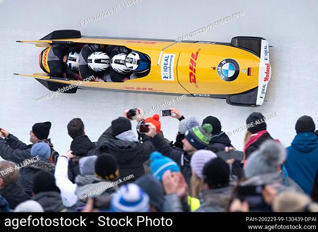 29 February 2020, Saxony, Altenberg: Bob: World Championship, four-man bobsleigh, men, first run. Nico Walther (r-l), Paul Krenz