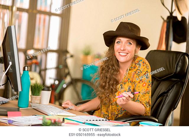Stylish professional woman at work in her office