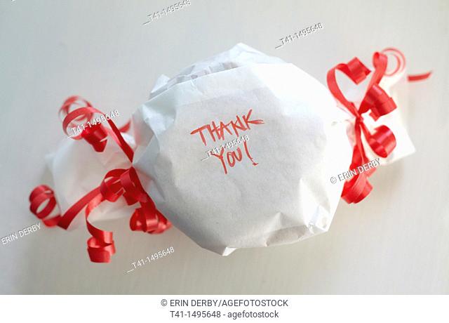 A wrapped gift with the words 'Thank You' on it