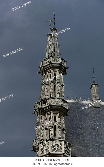 Spire with a statue and architectural detail of the Town Hall, Great market square, Leuven, Belgium, 15th century