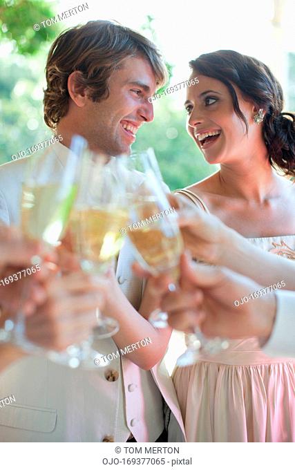 Guests toasting with champagne at wedding reception