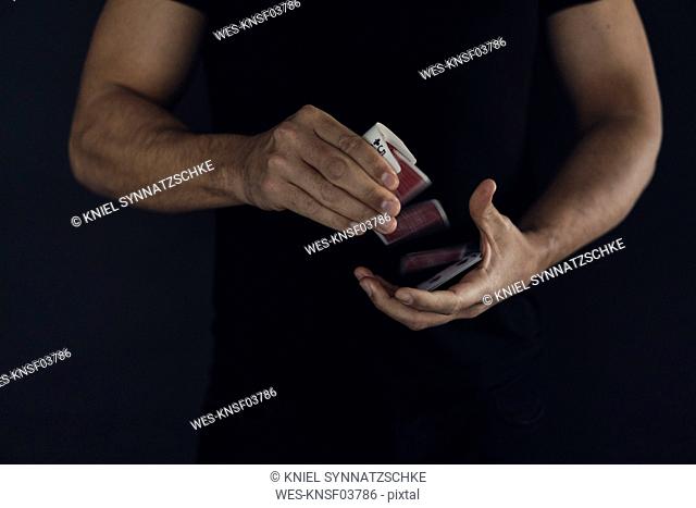 Man's hands shuffling cards