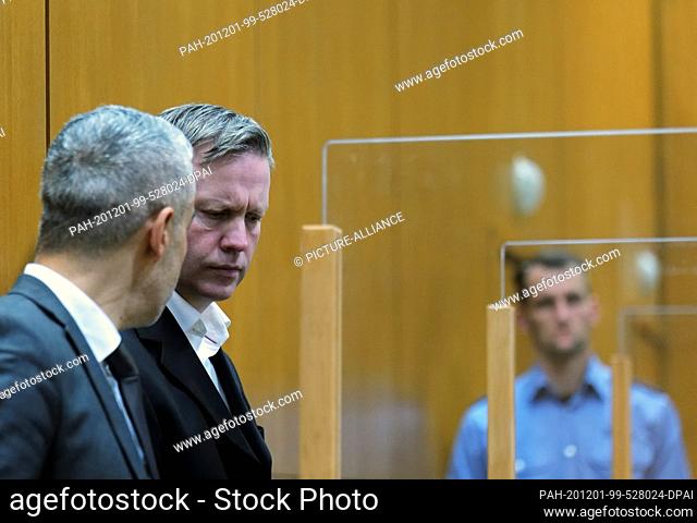 01 December 2020, Frankfurt/Main: The main defendant Stephan Ernst (2nd from left) and his lawyer Mustafa Kaplan wait in the courtroom of the Higher Regional...